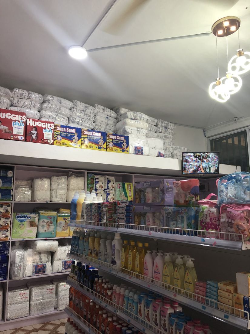 Diaper bales and boxed diapers on high shelves