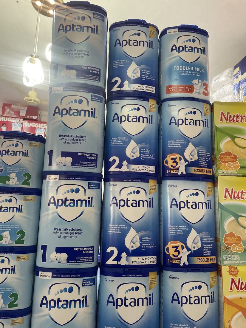 Shelves of infant formula tins